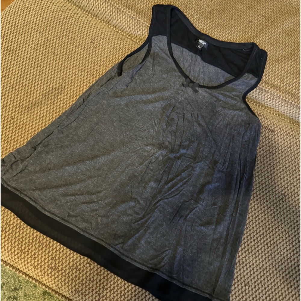 Classy tank top. Slightly worn.